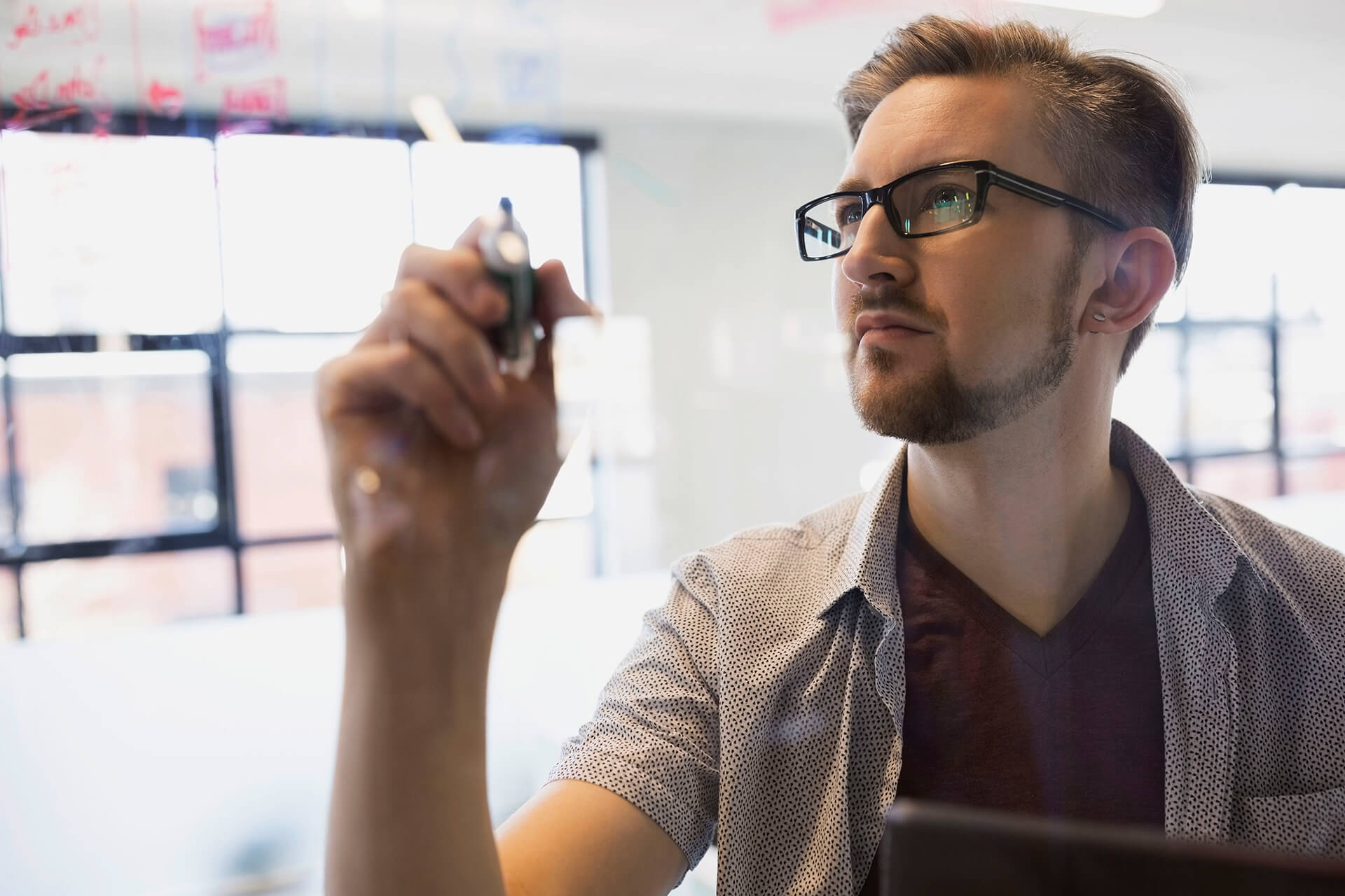 A man writing on a board
